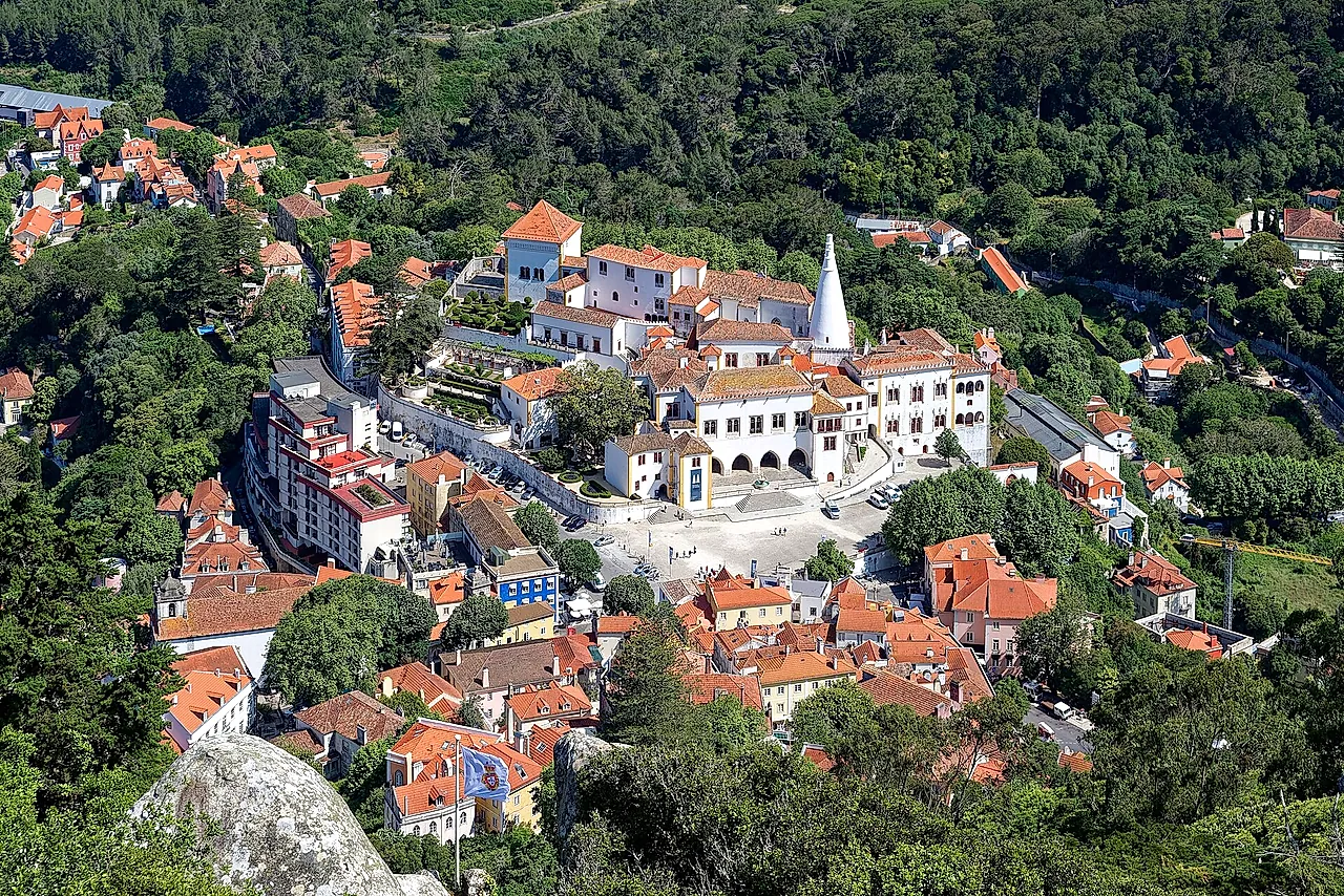 Sintra old town and the white National Palace with its two chimneys, seen from the Castle of the Moors
