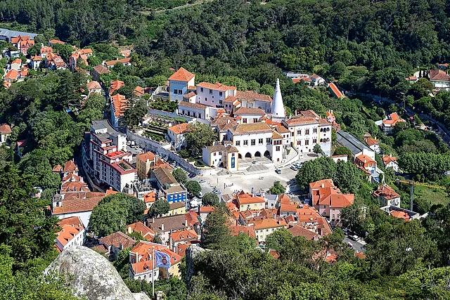 Sintra old town and the white National Palace with its two chimneys, seen from the Castle of the Moors